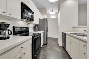 Modern kitchen with full appliances.