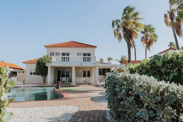 Charming Private Villa with Poolside Bliss – Relax in your own slice of paradise with lush landscaping and elegant outdoor seating.