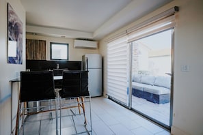 Compact Kitchenette with Patio Access – Ideal for light meals or morning coffee, steps from the outdoor lounge.