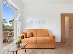 Furniture, Interior Design, Couch, Flooring, Floor, Wood, Living Room, Room, Apartment