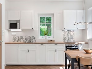 Kitchen, Countertop, Furniture, Cabinetry, Interior Design, Wood, Flooring, Floor, Drawer, Kitchen Appliance