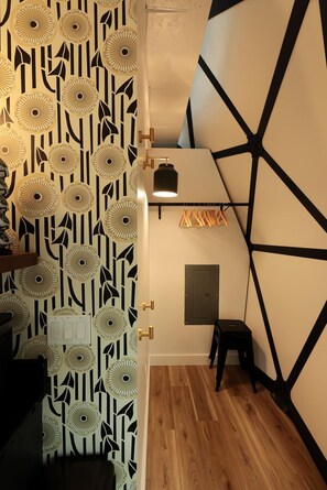 Next to the front door is a small closet for guests to store their belongings