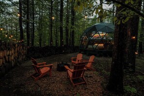 Each site has a set of adirondack chairs, bistro lights and a fire pit