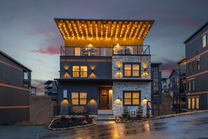 Stylish rooftop entrance with warm lighting and modern design.