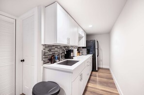 A compact kitchen with modern essentials.