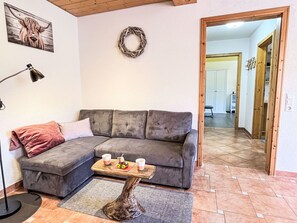 Furniture, Couch, Interior Design, Flooring, Wood, Floor, Living Room, Room, Home, Lighting