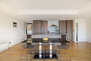Prepare meals with ease in a contemporary kitchen featuring quality appliances, generous bench space, and a breakfast bar.