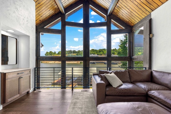 Breathtaking floor-to-ceiling lake views from the comfort of your living room—where relaxation meets the water’s edge.