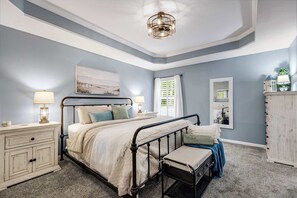 Main-level king suite with smart TV and shared bath access