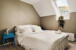 Comfortable sleeping space with soft lighting and a tranquil vibe.