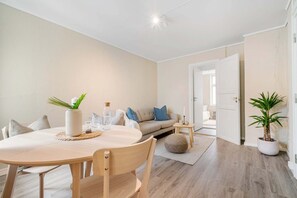 Bright dining area — Open-plan dining with natural light and Scandinavian-style furnishings for relaxed meals.