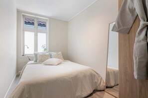 Bedroom with double bed — Peaceful sleeping space with plush bedding and calming decor.