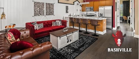 Step into Nashville charm with this bold, music-themed space! Enjoy plush seating, a full kitchen, and fun barn-style decor—complete with a disco ball. Ideal for relaxing or entertaining in Music City style!