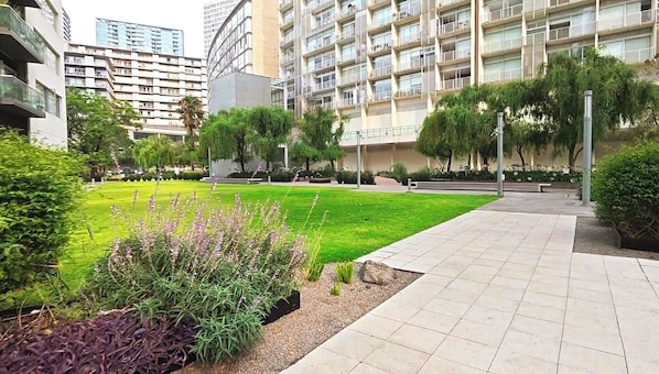 Serene apartment nestled in nature — jog, read, or relax among blooming flowers and quiet paths.