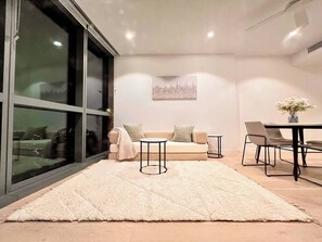 Living Room: coffe tables and three seat sofa can be easily turned into a tatmi inspired comfy Queen size or two single beds