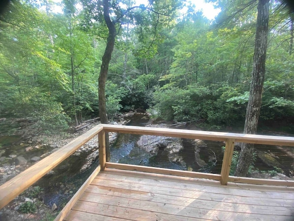 Back porch directly next to Paddy’s Creek. Partially covered and partially uncovered