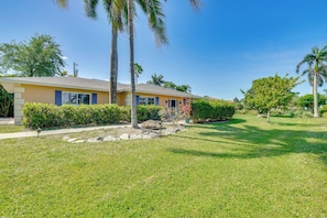 Property Exterior | Single-Story Home | Screened Lanai w/ Pool