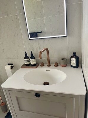 Corian sink with anti fog LED vanity mirror
