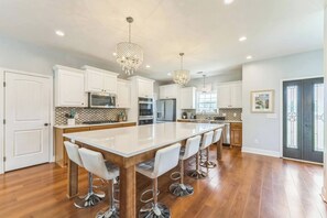 The heart of the home—this oversized island seats 7 and is perfect for dining, chatting, or sharing a morning coffee.