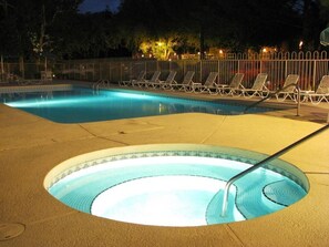 Relax in the outdoor pool and soothing hot tub, surrounded by inviting lounge chairs in a tranquil Sedona setting.