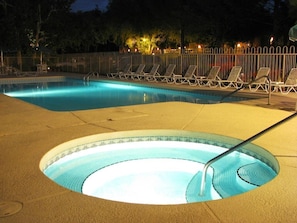 Relax in the outdoor pool and soothing hot tub, surrounded by inviting lounge chairs in a tranquil Sedona setting.