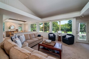 Spacious great room awaits as soon as you walk in the door.
Expansive windows overlooks the magnificent golf course views.