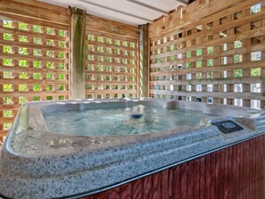 Relax in the bubbly, covered Hot Tub!