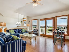 The open-concept Living Area with surround sound is perfect for movie nights or relaxing after a beach day.