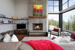 Cozy up by the fireplace and enjoy the views | Main Level