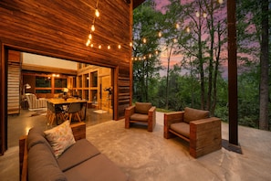 Bring the Outdoors and Indoors Together with an Openable Glass Garage Door