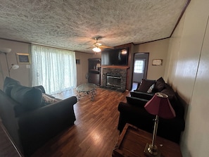 Sitting area 1 with Smart TV. This area opens up to the kitchen.