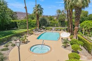 Pool & Spa surrounded by lush landscaping