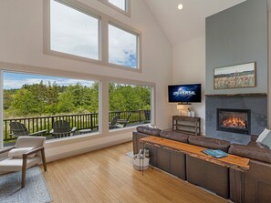 Living room with gas fireplace and Smart tv