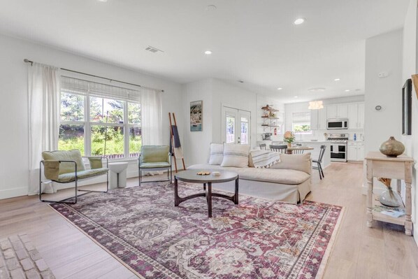 Walk into a spacious living room and open floor plan.