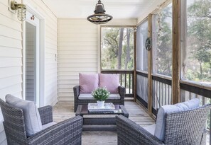 Nestled in the Jasmine blooms, is the screened front porch!