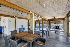 Relax in the shade beneath the house—challenge someone to a game of ping pong or fire up the grill for a laid-back afternoon.