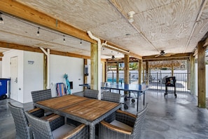 Relax in the shade beneath the house—challenge someone to a game of ping pong or fire up the grill for a laid-back afternoon.