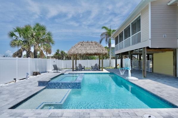 Relax and unwind in your private pool with a luxurious spillover spa.