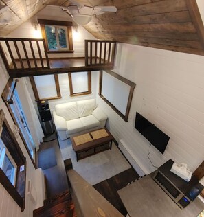 Main floor sitting area with coffee table that raises to a dinner table.