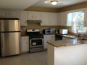 Fully Stock Kitchen with Gas Stove, Microwave, Ice Maker, and much more.