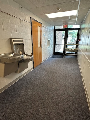 Wooden door on the left: Classroom 103.