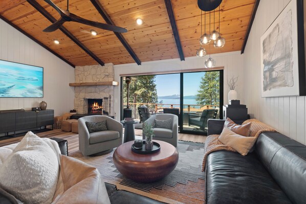 Living room with stacked door opening to deck