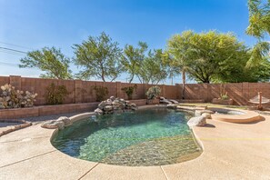 Close-up of the sparkling pool with waterfall feature.