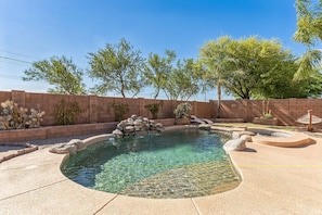 Close-up of the sparkling pool with waterfall feature.