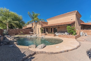 Your private resort-style backyard featuring pool and spa.