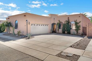 Wide view of the quiet neighborhood and two-car driveway