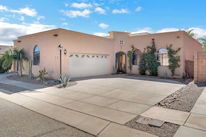 Wide view of the quiet neighborhood and two-car driveway