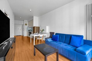 Living Room with Full Sofa Bed and Dining Area - Smart TV for your enterteinment | Book Now with RENTUJEMY.COM