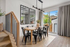 Dining table with seating for 8, and 4 seats at the kitchen island.