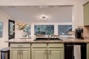 Kitchen overlooking backyard views